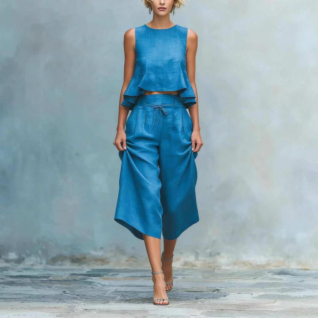 Women's chic crop top & wide leg pant set. Effortless, comfortable two-piece outfit for stylish summer fashion.