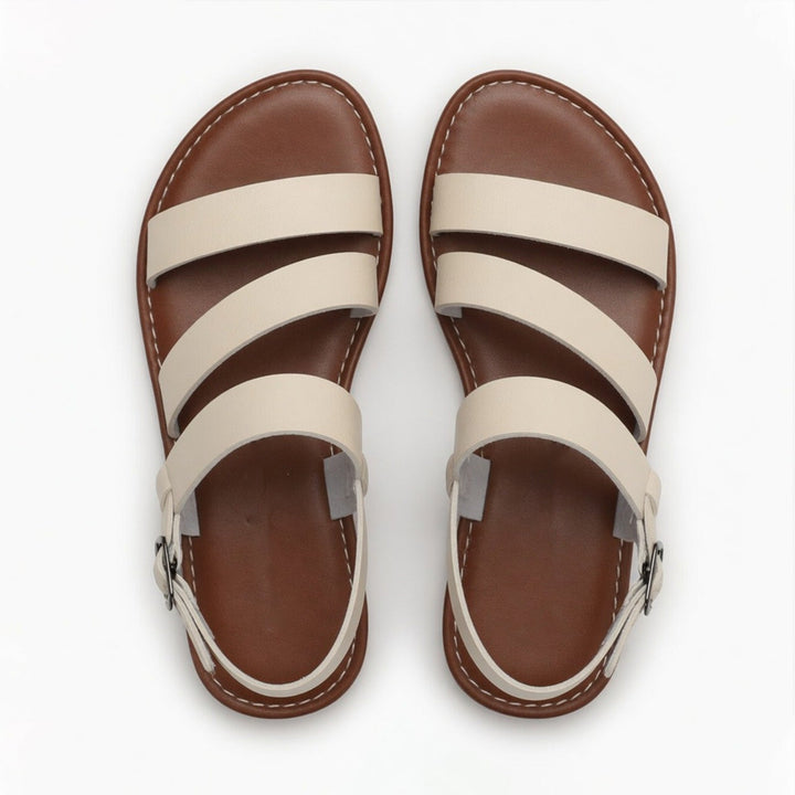 Comfortable women's casual flat sandals, chic crossover straps, great for summer.