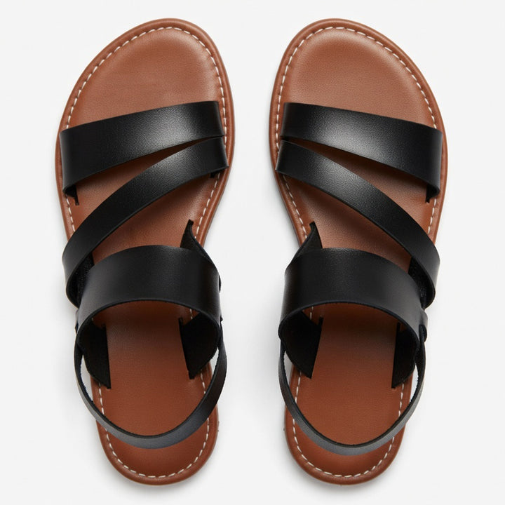 Summer style women's flat sandals with comfortable open-toe and crossover straps.