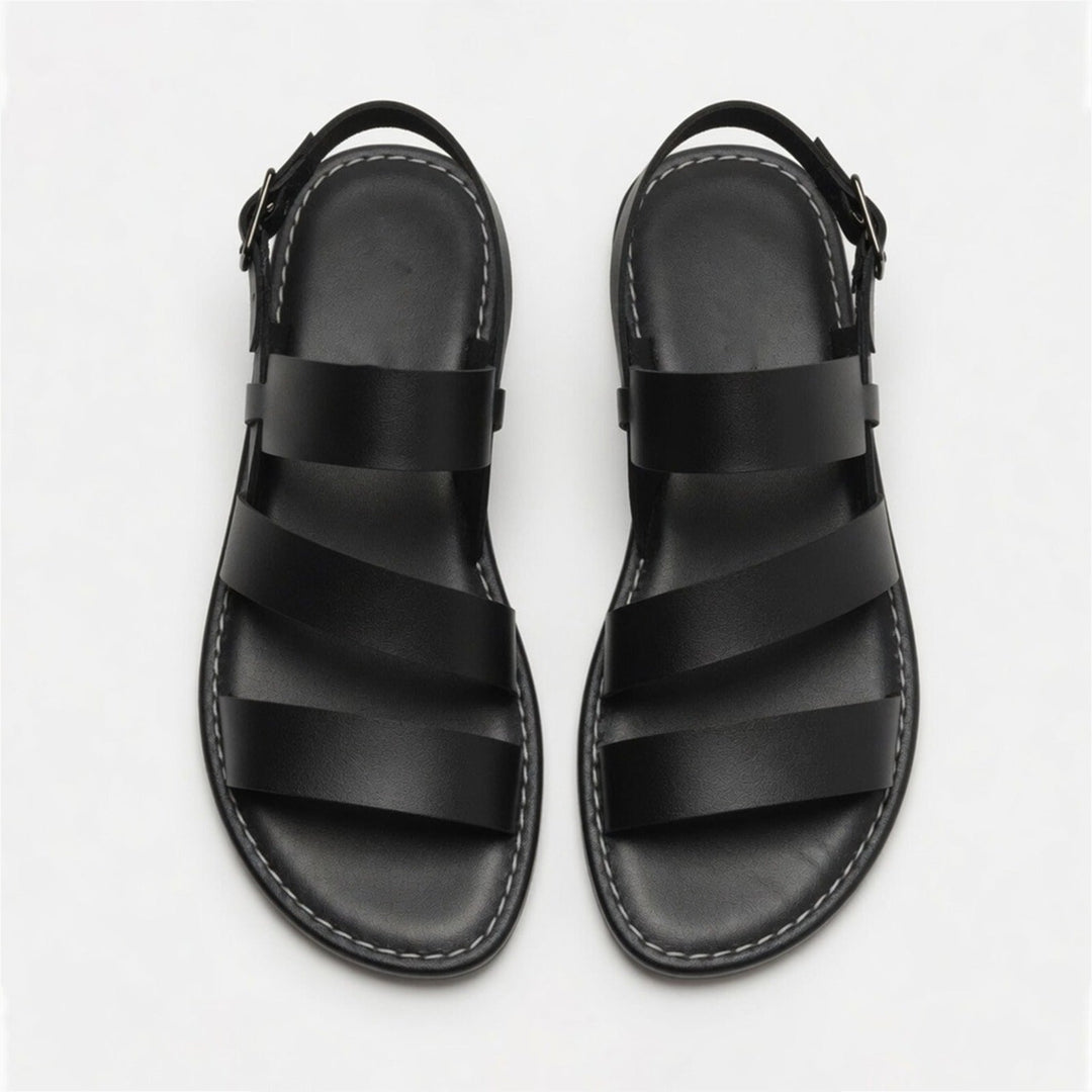 Vacation-ready women's flat sandals, chic crossover straps, comfortable and casual.