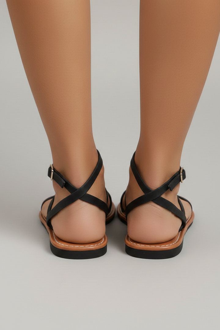 Stylish women's flat sandals with open toe & comfortable strappy design, perfect for casual summer outings.