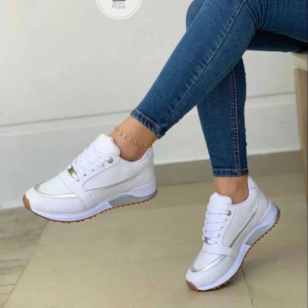 Comfortable women's walking sneakers with a trendy platform sole, detailed with golden accents & secure lace-up.