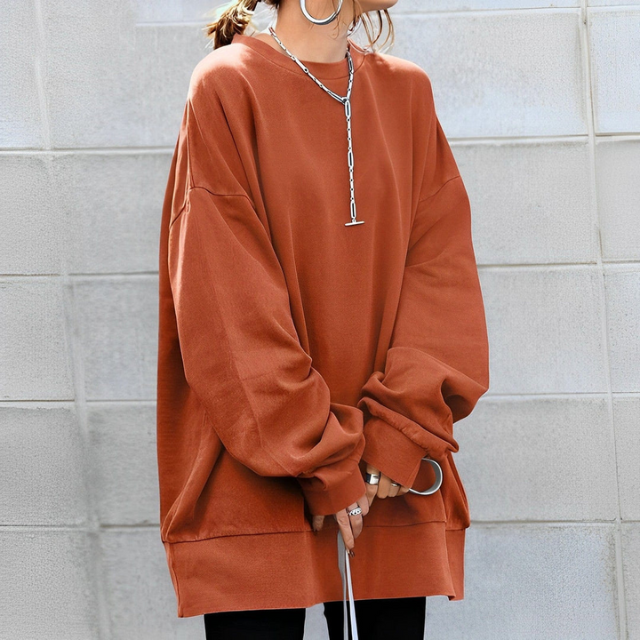Stylish women's oversized pullover sweater. Warm knit long-sleeve, excellent for comfortable casual winter fashion.