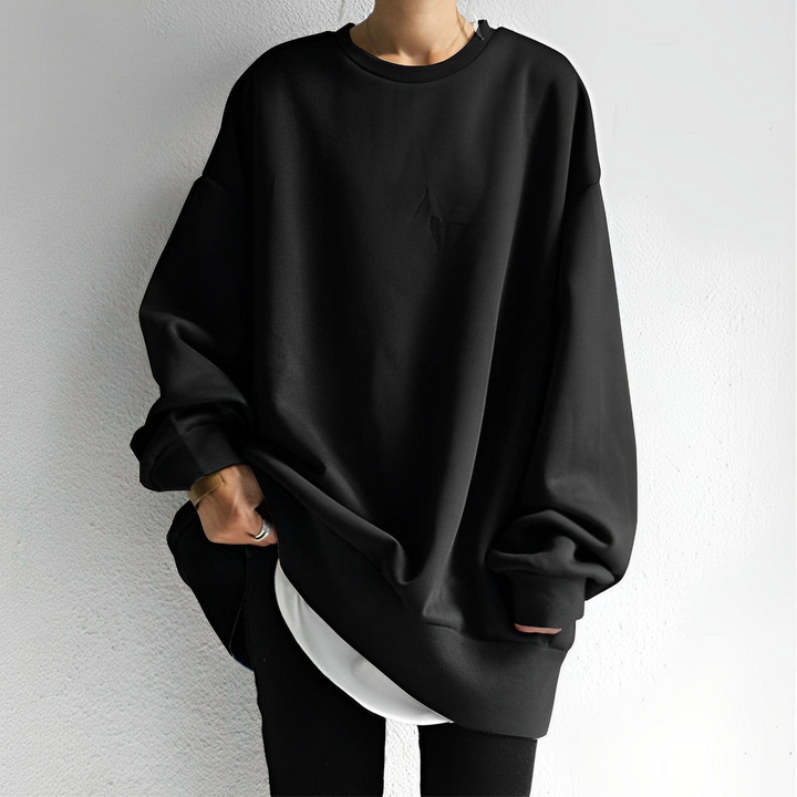 Modern women's oversized sweater. Warm, comfortable long-sleeve knit, perfect for stylish everyday fall & winter wear.