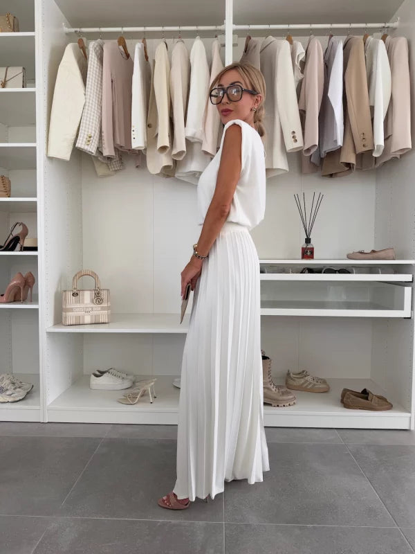 Full-body shot of a model wearing the women's chic pleated two-piece outfit.