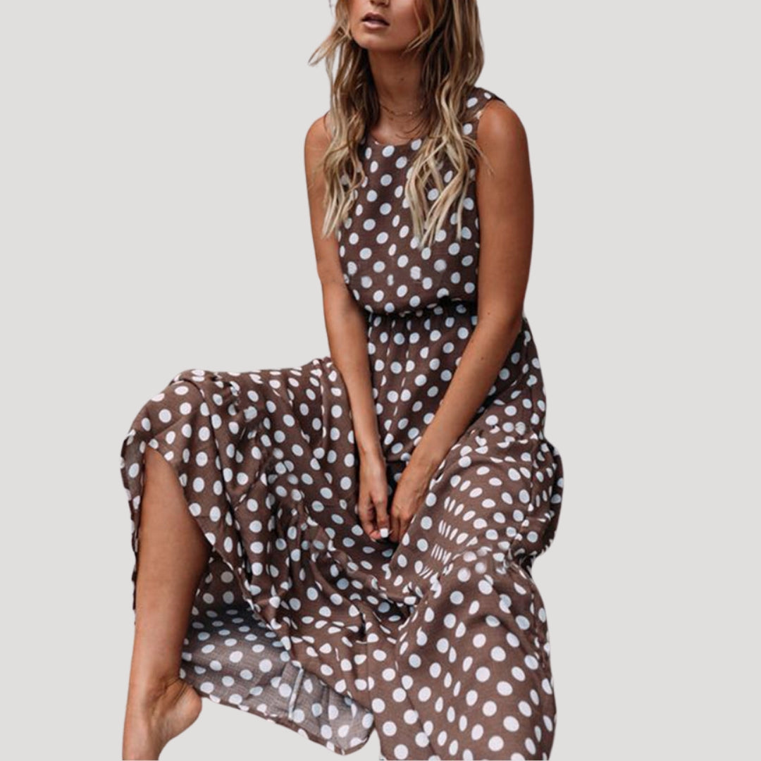 Women's chic polka dot sleeveless midi dress, A-line cut, perfect for summer casual wear or day events.