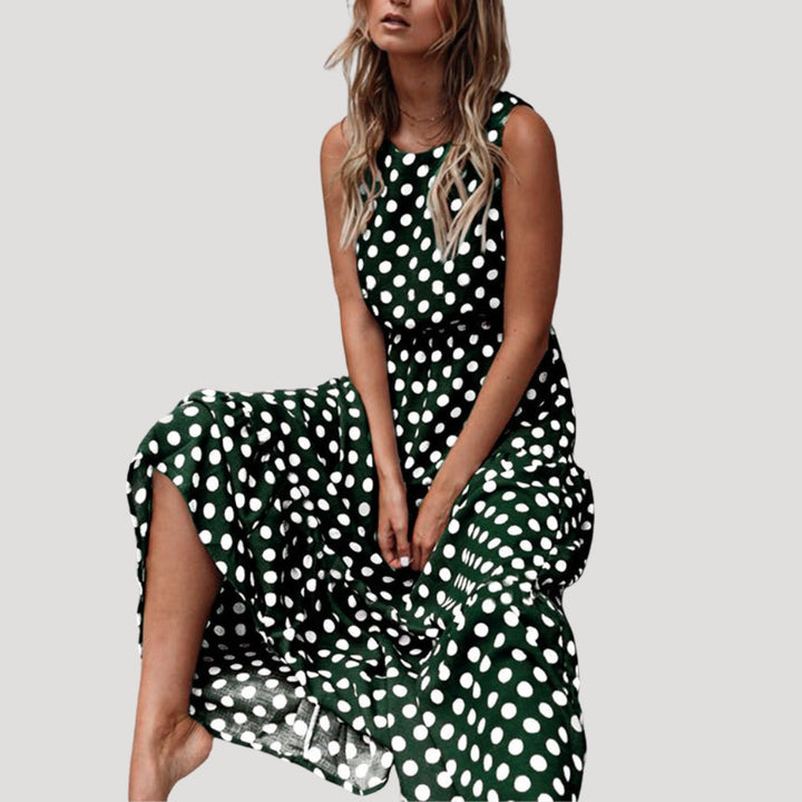 Stylish women's round neck polka dot midi dress, sleeveless design. A comfortable and chic choice for summer.
