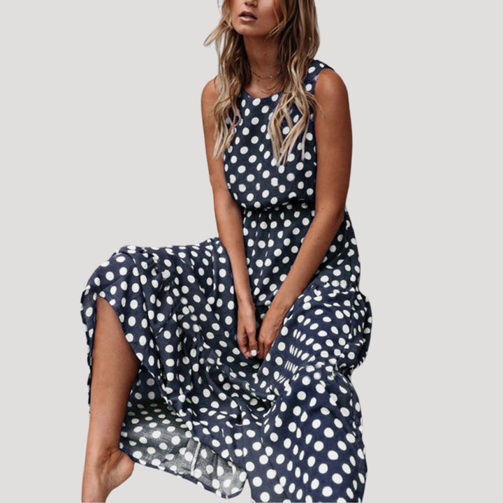Chic women's polka dot midi dress, sleeveless with a flowy A-line silhouette. Perfect summer casual day dress.