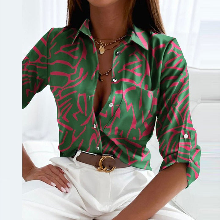 Front view: Fashionable long sleeve graphic print button-down shirt for women.