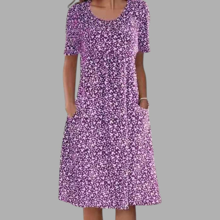 Beautiful women's midi dress with an elegant print, perfect for chic summer events & occasion wear.