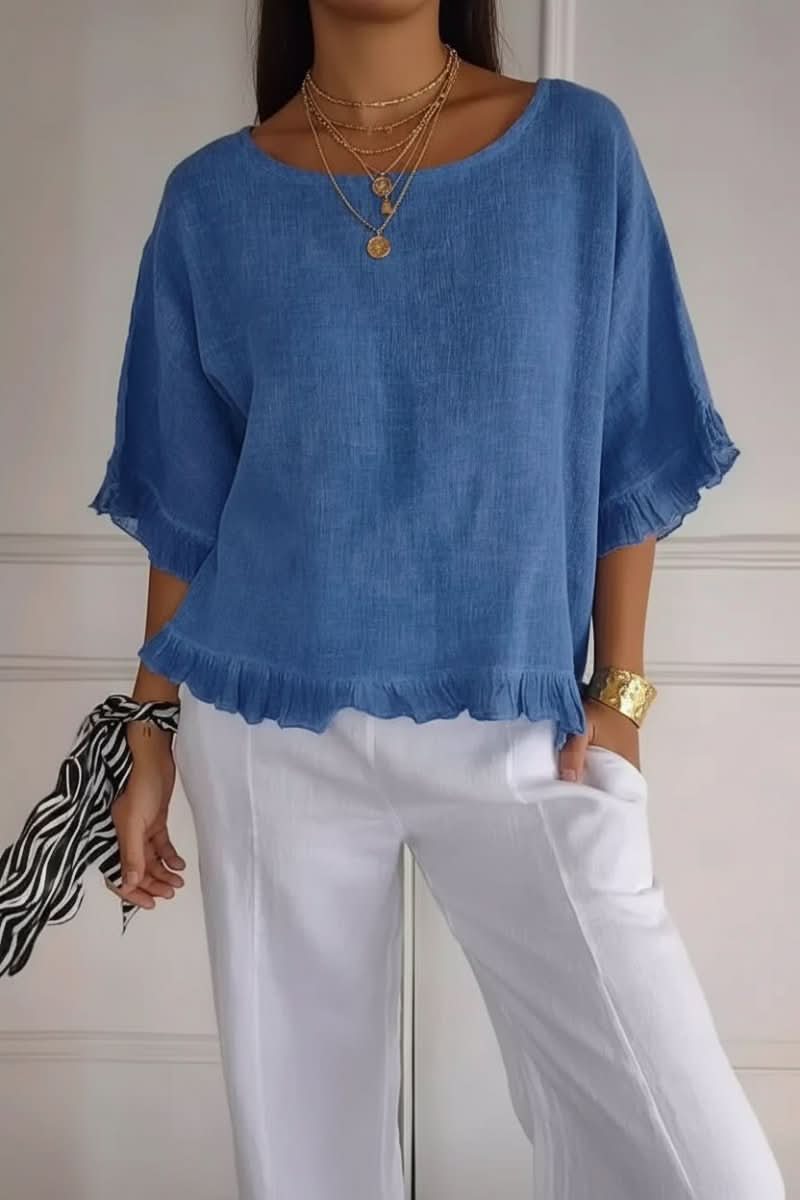 Women's chic ruffle blouse. Elegant and versatile women's top for effortless style.