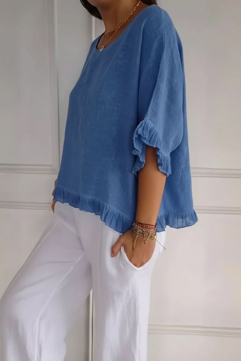 Elegant women's ruffle top. Fashionable chic blouse, perfect for summer casual or work wear.