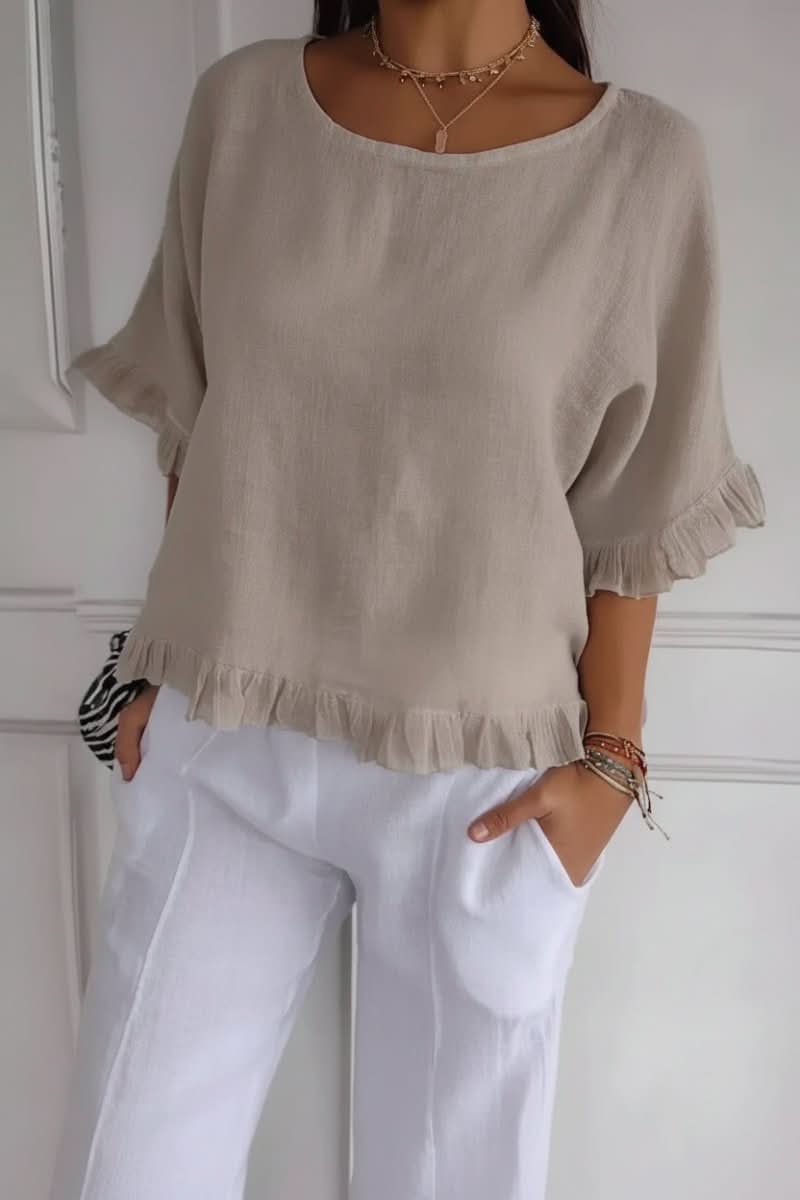 Women's fashionable ruffle blouse for chic style. An elegant and versatile summer top for women.