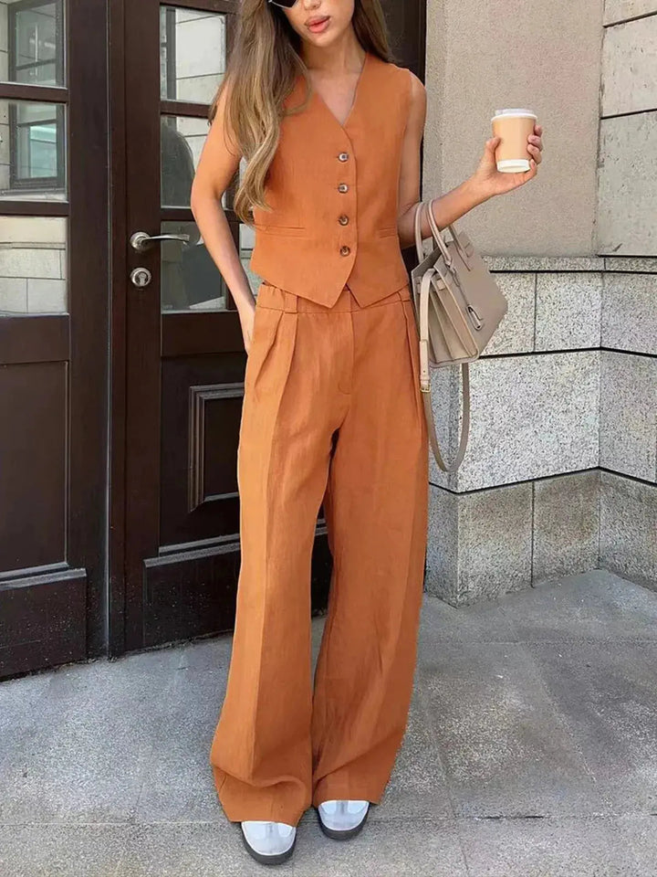 Ladies' modern two-piece set with tailored waistcoat and relaxed wide-leg trousers, offering a chic & comfortable fit.