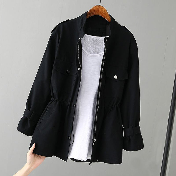 Close-up of a women's utility jacket zipper, highlighting the chic design and practical casual wear appeal.