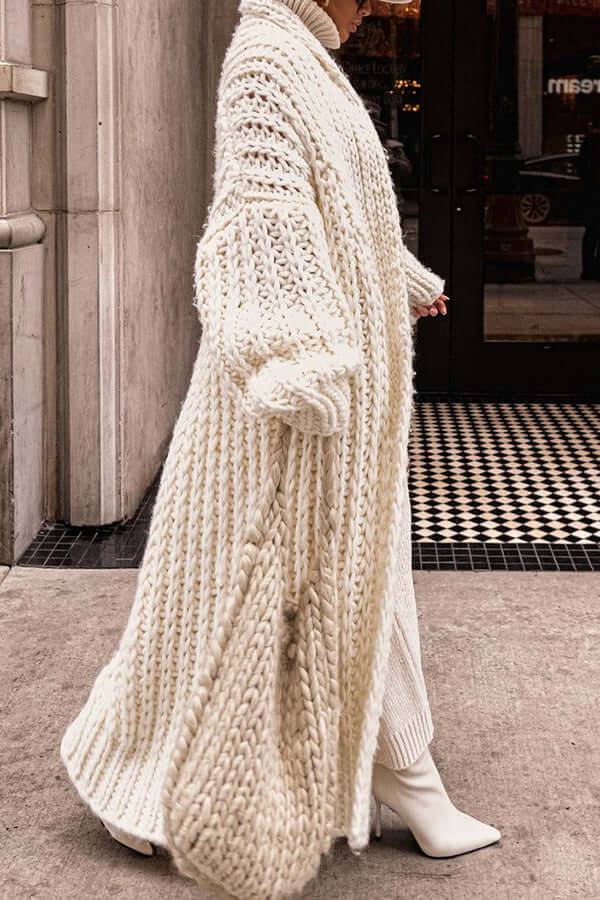 Full body shot of model wearing women's elegant knit cardigan and matching sweater set