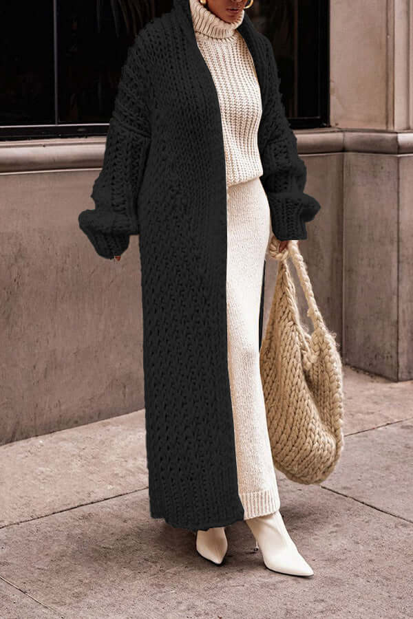 Detail of the button-front closure on women's chic knit cardigan sweater set, fall fashion