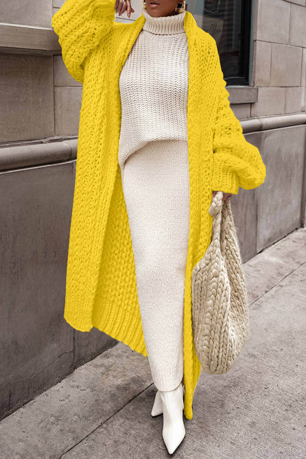 Fashionable women's knit cardigan sweater set, showcasing a modern winter wear look