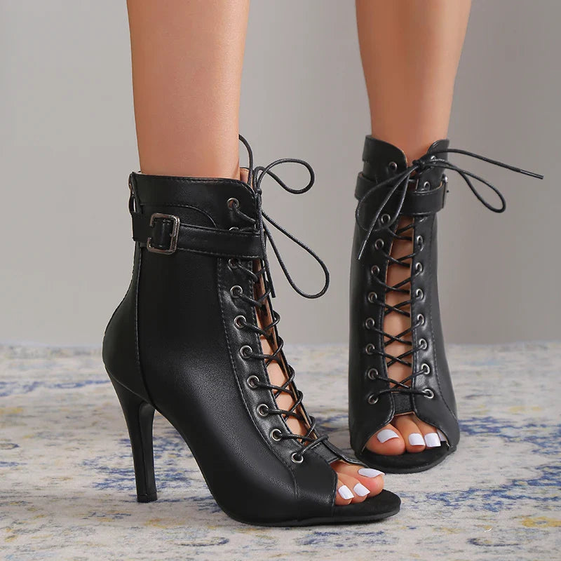 Stylish women's black lace-up heels, ideal for fashion-forward party outfits.