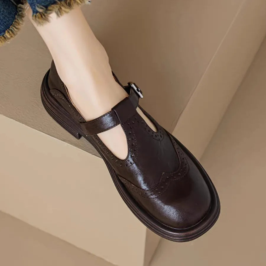 Close-up of a women's T-strap leather shoe, highlighting classic style and quality.