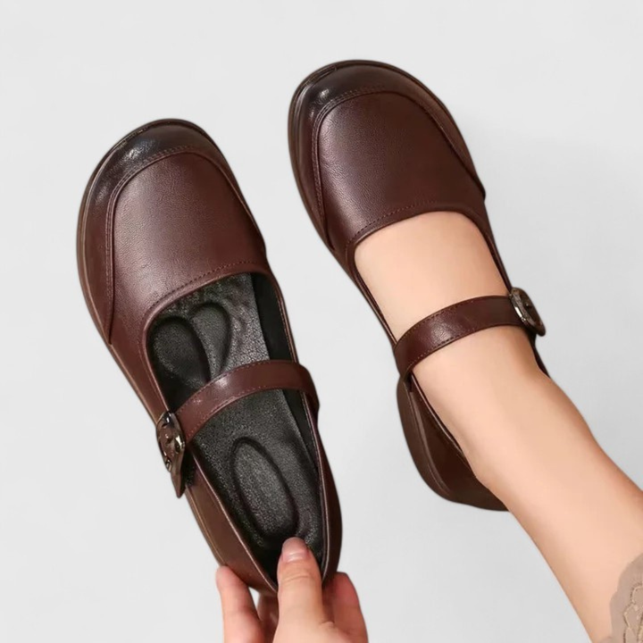 Close-up of the classic buckle detail on women's spring comfort shoes, tan color