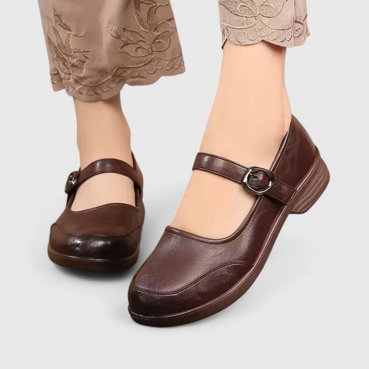 Side profile of women's tan spring comfort shoes with elegant buckle embellishment