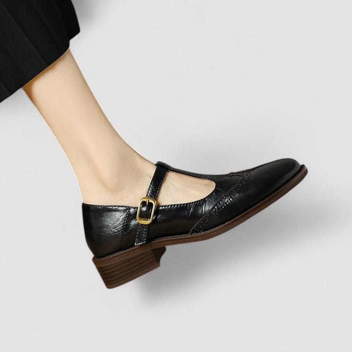 Detail of the buckle closure on a women's classic Mary Jane flat shoe, comfortable and stylish