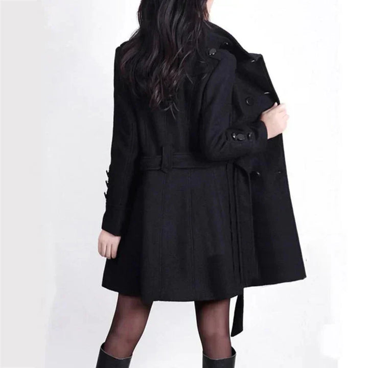 Elegant ladies long coat, double-breasted with a belt. Ideal formal outerwear for office or stylish occasions.