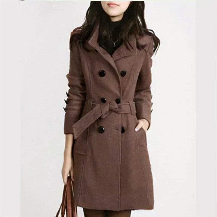 Classic double-breasted women's coat with an adjustable belt. Essential elegant outerwear for stylish ladies.