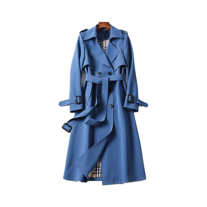 Front view of a women's classic long trench coat, double-breasted with functional belt, elegant design.