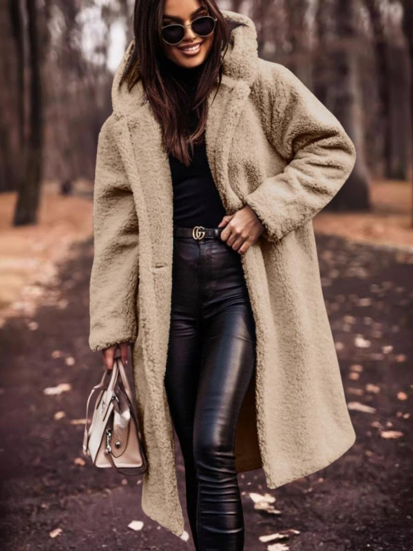 Women's classic double-breasted trench coat with belt. Elegant fall & winter outerwear for all-weather style.