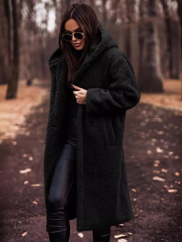 Elegant women's double-breasted trench coat. Classic belted design for stylish all-weather fall & winter fashion.