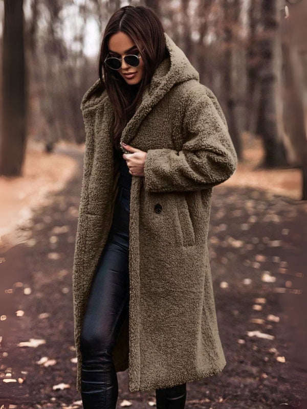 Sophisticated women's belted trench coat, double-breasted for a timeless look. Ideal fall & winter jacket.