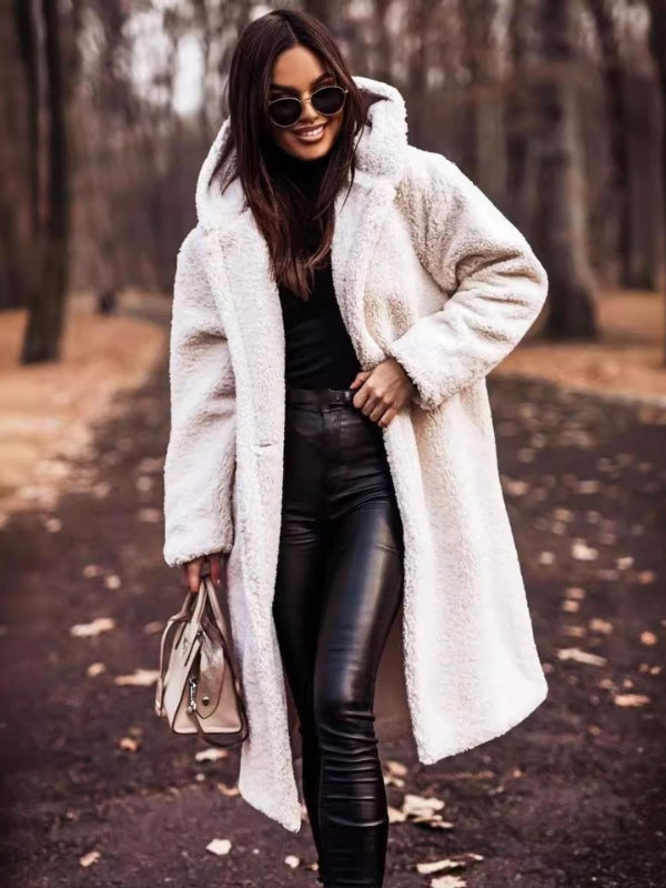 All-weather women's double-breasted trench coat. Features a flattering belt for an elegant, classic silhouette.