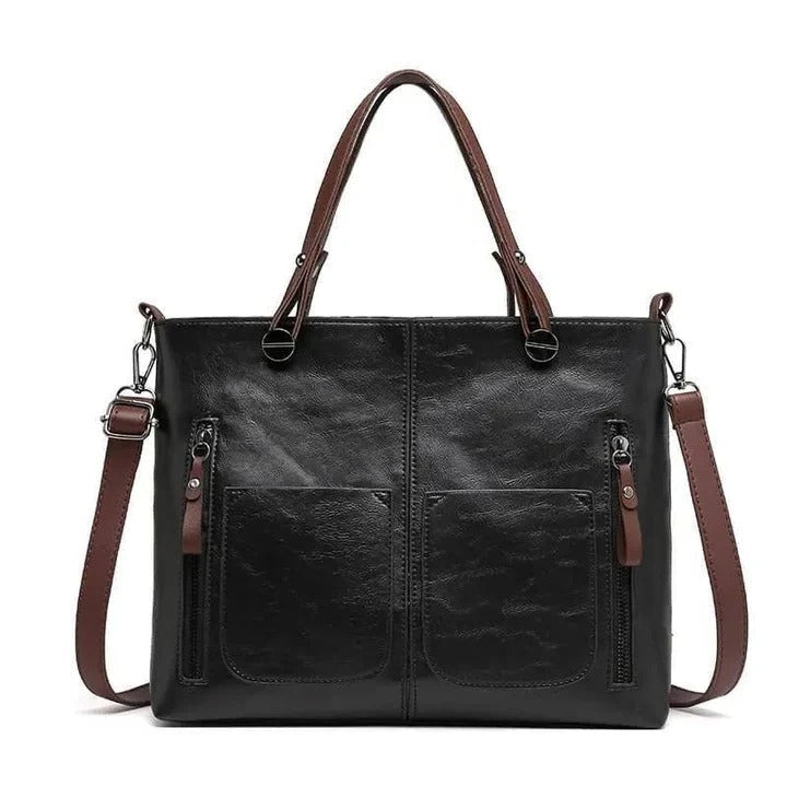 Elegant women's leather shoulder bag with a sleek, minimalist design for versatile wear.