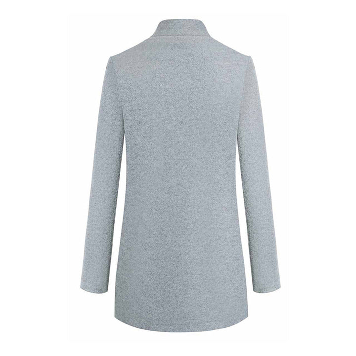 Full-length view of a women's classic tailored winter coat, demonstrating its elegant silhouette.