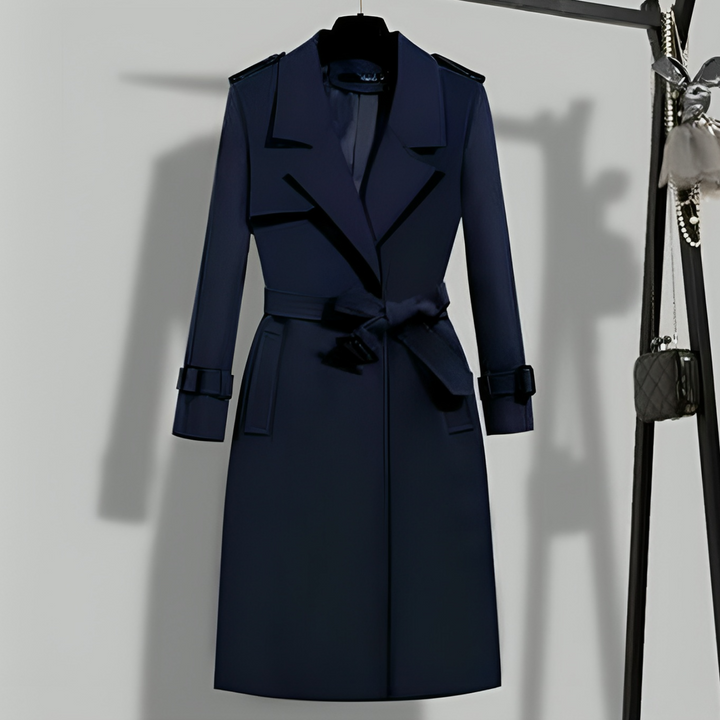 Versatile women's trench coat, classic long jacket with a belt and button details, ideal for elegant fall fashion.