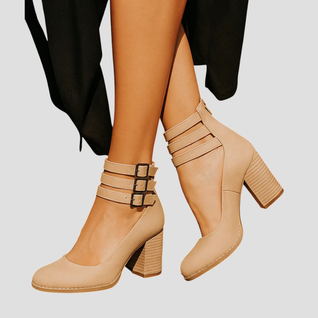 Fashionable women's closed toe block heels, designed with a secure buckle strap and sturdy heel for day-long wear.
