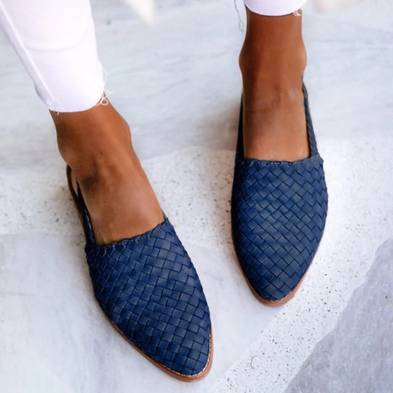 Stylish women's closed toe flat mules, perfect slip-on shoes for casual or smart casual outfits.