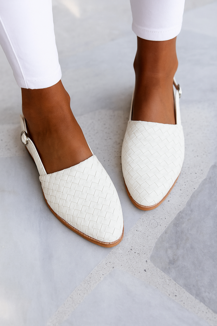 Women's backless closed toe slip-on flat mules, combining easy wear with a stylish modern look.