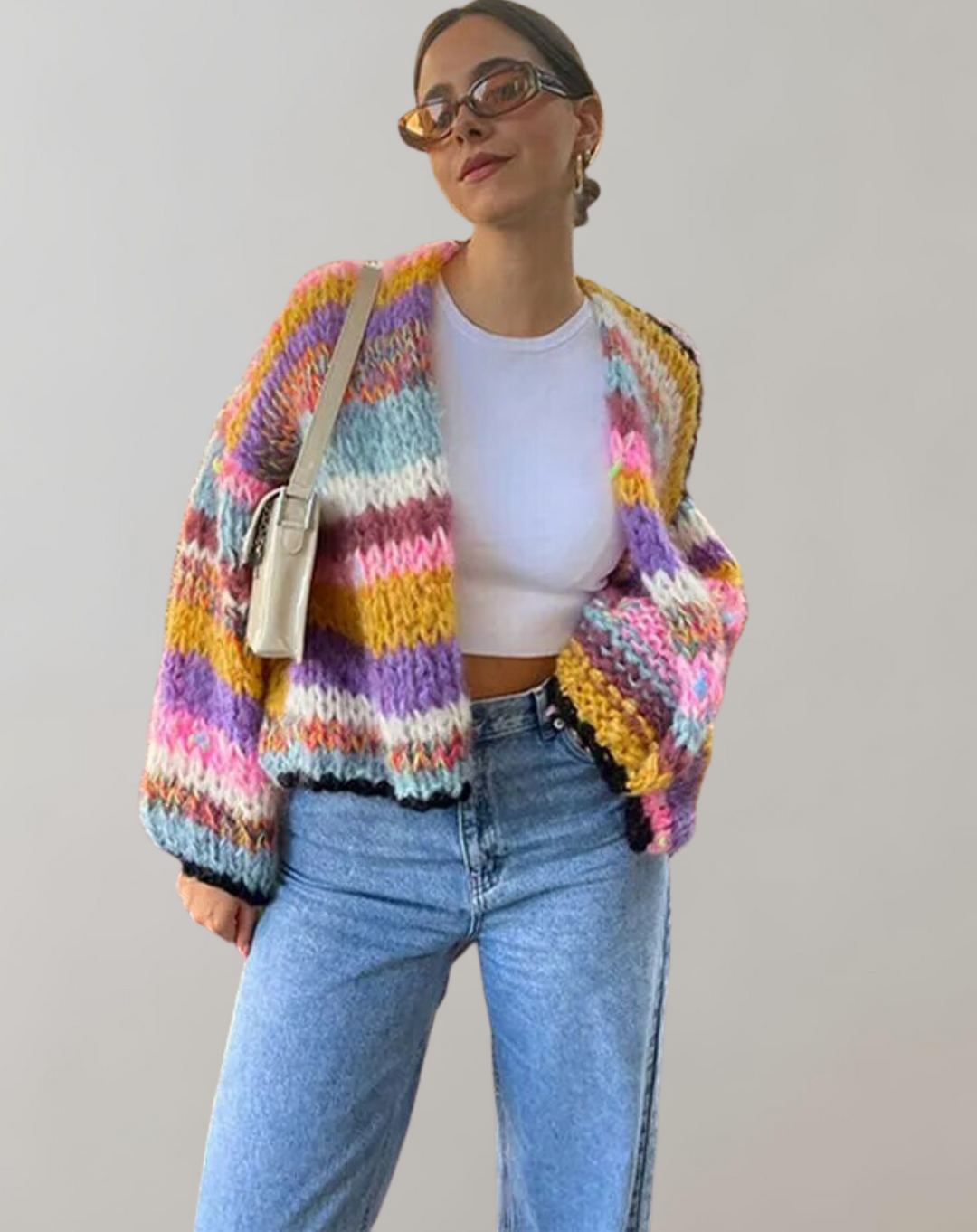 Vibrant women's knitted cardigan with an open front, offering a comfortable and loose fit for casual wear.