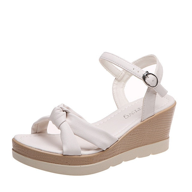 Elegant women's comfort platform wedge sandals, featuring an adjustable ankle strap.