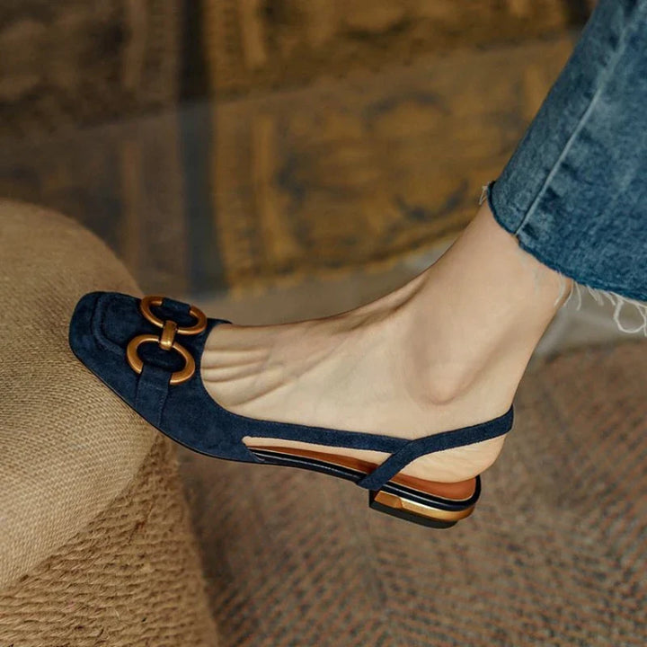 Women's slingback flats in black with subtle chain accent, offering all-day comfort footwear.