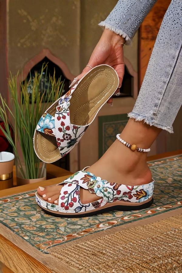 Women's comfort wedge slip-on sandals with perforated design, ideal for casual summer wear & walking. Stylish & breathable.