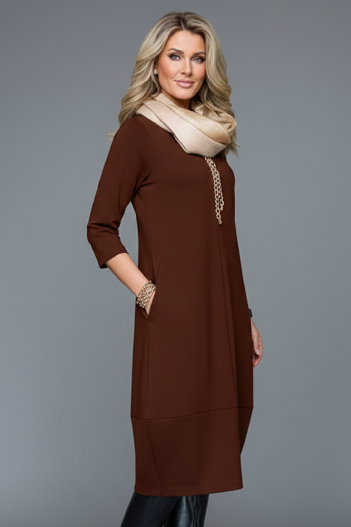 Flattering A-line midi dress for women with 3/4 sleeves, round neck & pockets; versatile casual style.