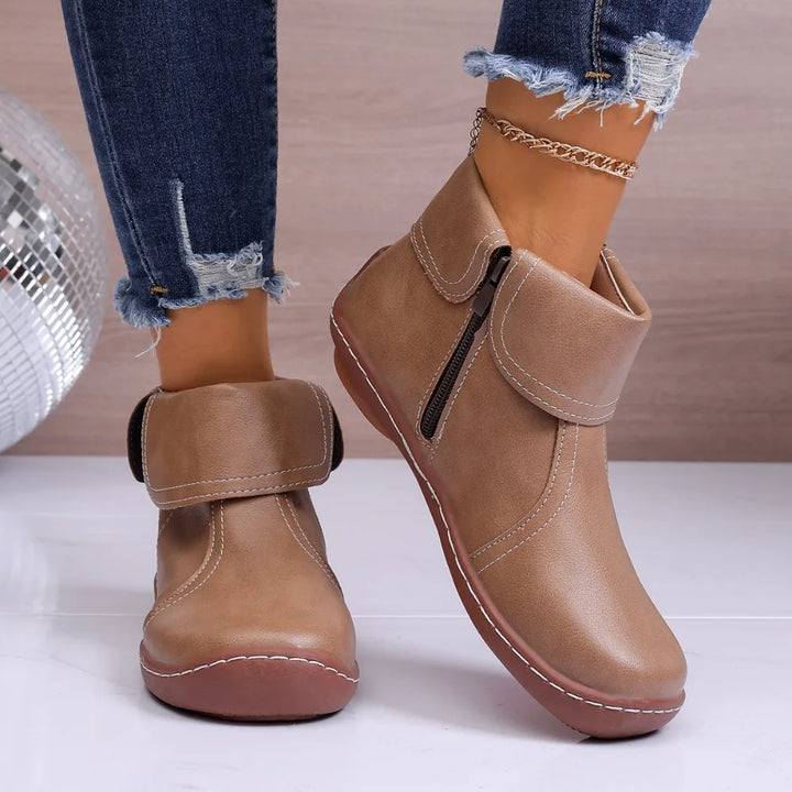 Women's fashion ankle boots with a subtle buckle detail, adding a touch of elegance.