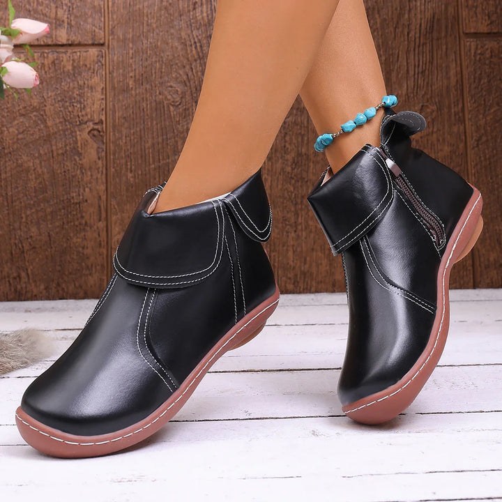 Women's zip ankle boots in a rich burgundy, a stylish choice for fall and winter.