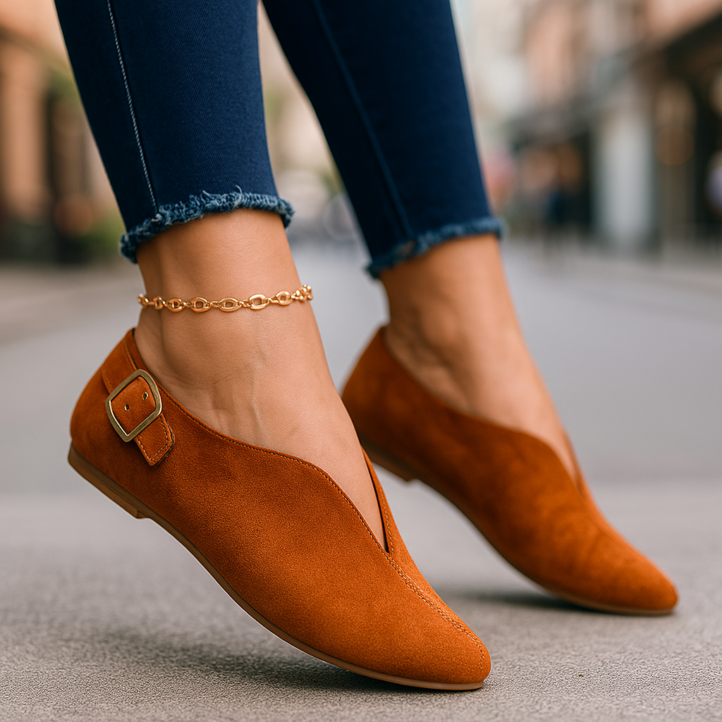Close-up of a women's loafer featuring a stylish buckle detail and comfortable flat sole
