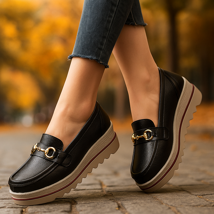 Women's comfortable black platform loafers with gold chain detail, orthopedic support