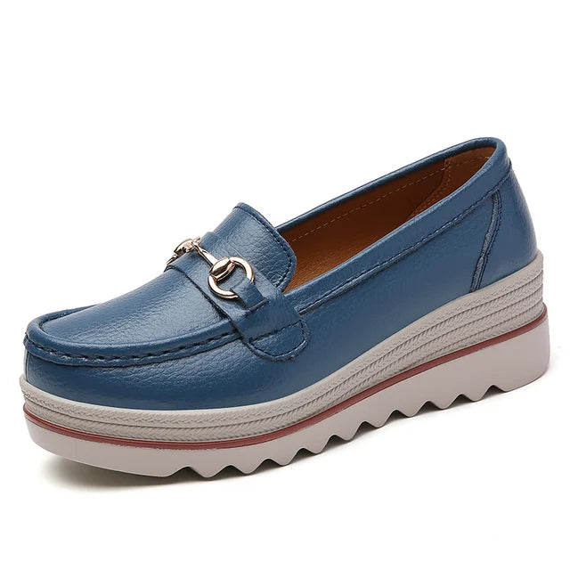 Women's black platform loafers, featuring a comfortable design and stylish chain